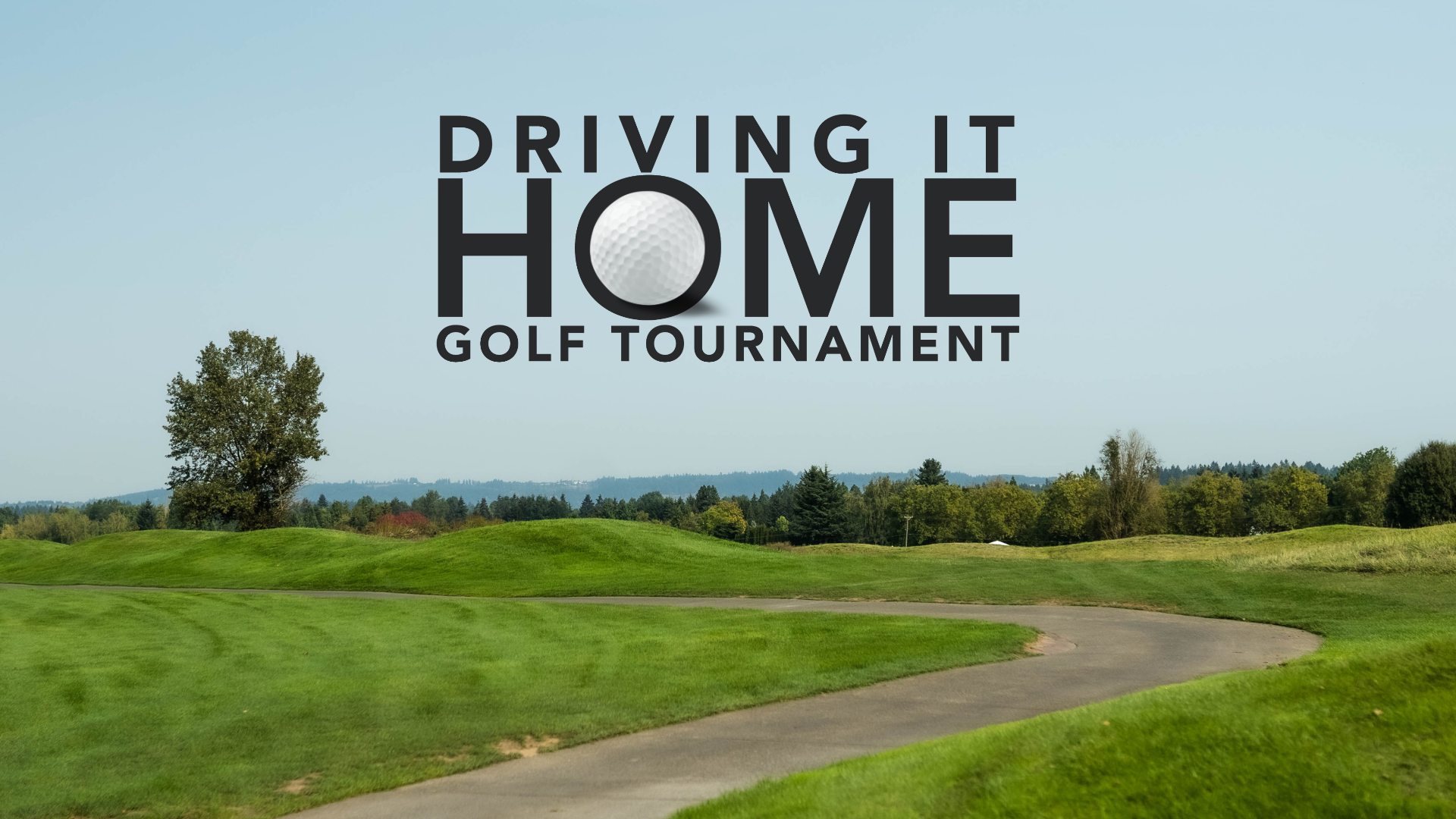 Driving It Home golf tournament banner on lush green course