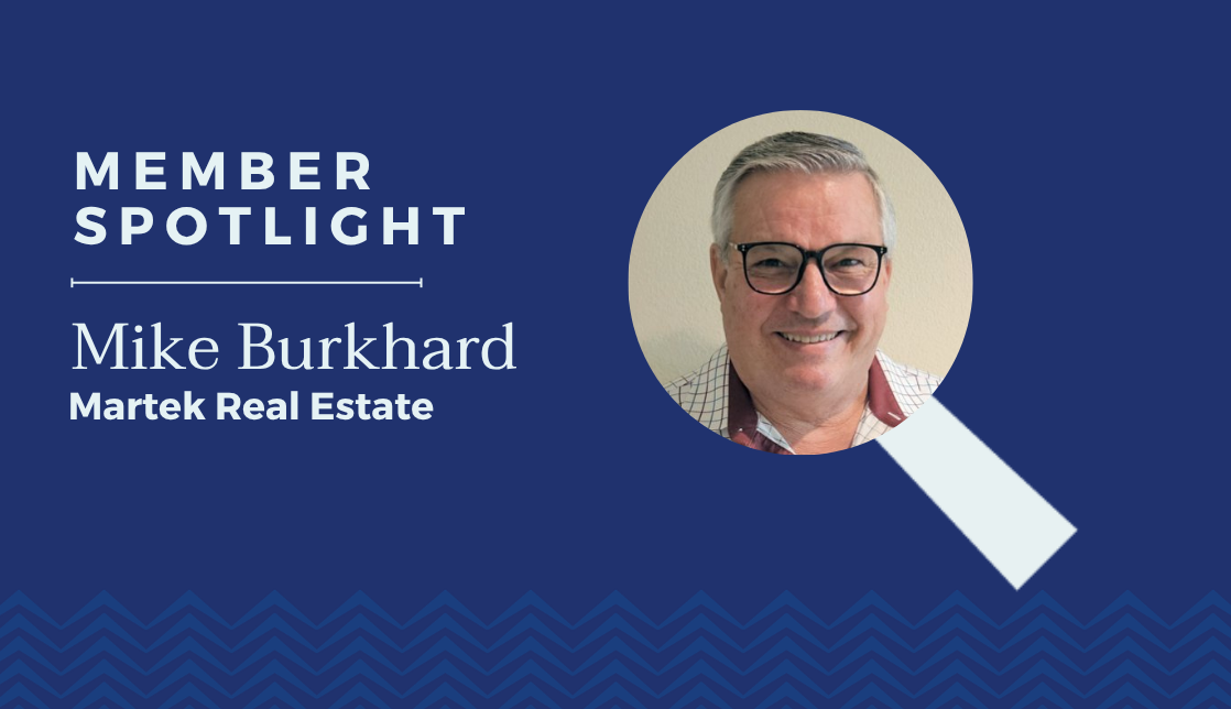 Member spotlight on Mike Burkhard from Martek Real Estate with a magnifying glass graphic